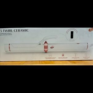 T3 Curling Iron. 1 1/4” barrel. White with rose gold detail.